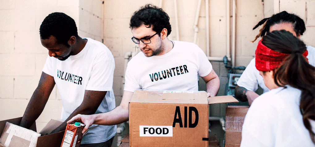 volunteers boxing food donations